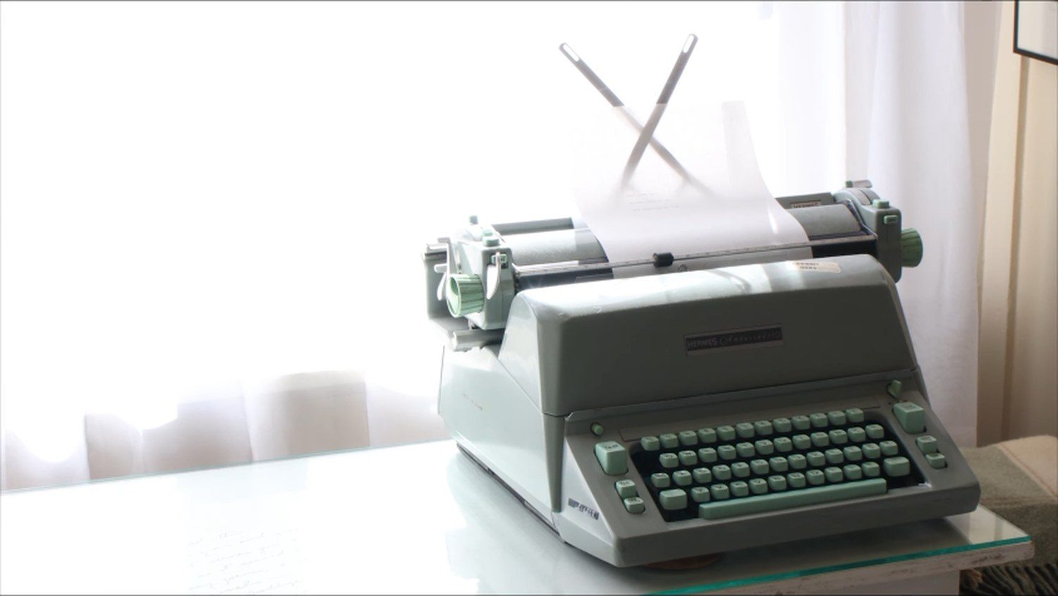 A vintage typewriter in a sunlit window, from the film's closing credits